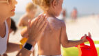 caring-mother-apply-sunblock-back-her-little-daughter-1-144x81.jpg